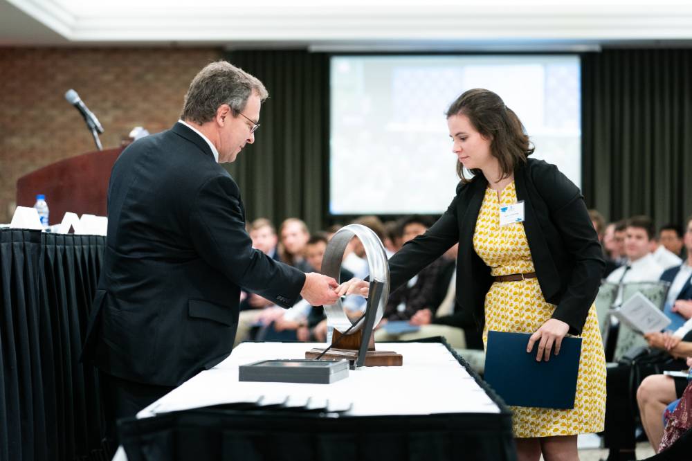 A student receives her ring